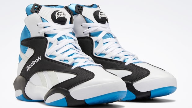 White, black, and blue Reebok Shaq shoes.